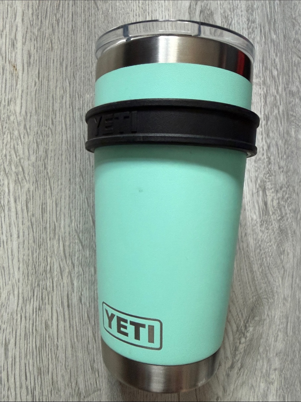 Yeti cup with detachable handle and lid.